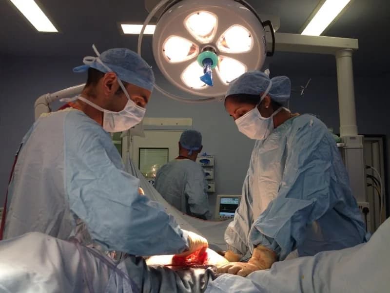 Mr Lamah operating in theatre